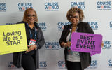 Advisors showed off at CruiseWorld with signs.