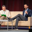 Travel Weekly editor in chief Arnie Weissmann (left) in conversation with Carnival Corp. CEO Josh Weinstein at CruiseWorld.