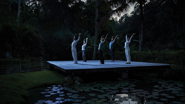 Guests participate in a Full Moon Yoga session at the Four Seasons Bali at Sayan.