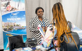 Barbados Tourism Marketing's Tia Broomes, left, talked to an attendee at the Exhibitor Showcase.