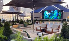 A variety of plants line a sitting area in the Rooftop Garden on Celebrity Ascent.