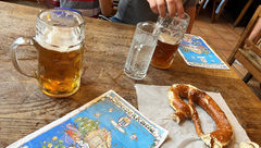 A giant pretzel and some cold brews at Munich's famous Hofbrauhaus am Platzl.