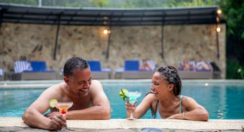 Relaxing in the pool at the Rio Celeste Hideaway Hotel on a Geluxe tour in Costa Rica.