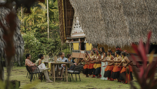 Guests enjoying an on-shore cultural experience as part of their stay aboard the Four Seasons Explorer, Palau.